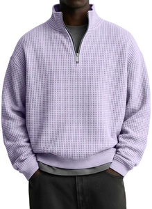 Macro shot of light purple waffle knit texture on men's half-zip polo sweatshirt