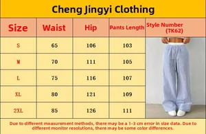Detailed size chart with measurements for striped high-waisted wide-leg lounge pants