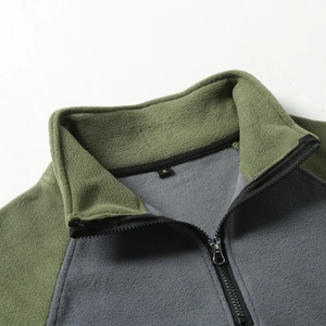 Close-up of military green fleece jacket with half-zip stand collar and size label