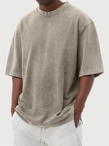 Close-up of vintage washed grey cotton fabric and ribbed collar on oversized t-shirt