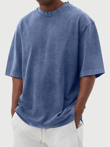 Close-up of blue-purple oversized T-shirt featuring vintage acid wash texture and heavy cotton