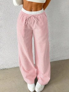 Detail of pink and white vertical striped wide leg pants with an elastic drawstring waist