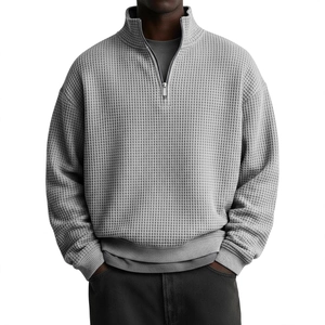 Men's grey waffle knit quarter-zip pullover sweater with a relaxed casual fit