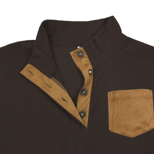 Close-up of ribbed corduroy sweatshirt featuring a mock neck and faux suede chest pocket