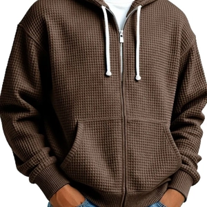 Men's brown waffle knit zip-up hoodie featuring a drawstring hood and loose fit style