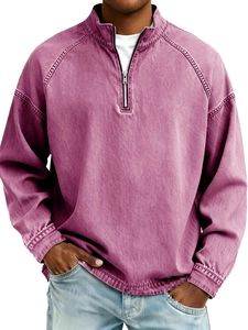 Close-up of vintage washed plum men's quarter-zip sweatshirt with metal zipper detail