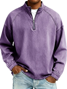 Detail of vintage mineral washed purple half-zip sweatshirt with stand collar and metal zipper