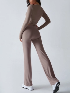 Detail view of taupe yoga set featuring high-waisted flared pants and slim fit long sleeve top