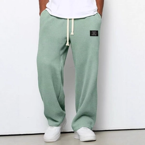 Green waffle knit straight leg sweatpants with drawstring waist for casual men style