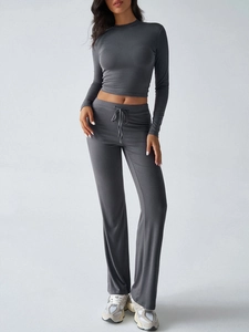 Detail of high-stretch dark grey yoga set featuring drawstring waist and ribbed texture