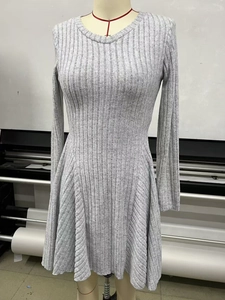 Close-up of gray ribbed knit fabric texture on an elegant long sleeve A-line mini dress
