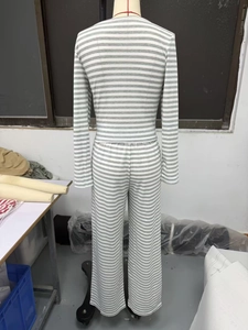 Detail view of the soft ribbed knit fabric texture on the striped wide-leg lounge set