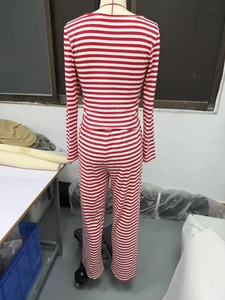 Detail view of red and white striped knit lounge set with long sleeves and pants