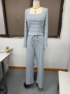 Detail of blue and white striped ribbed knit two-piece set featuring square neck top and wide leg pants