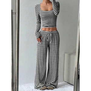 Women's chic black and white striped high waist wide leg pants set with long sleeve crop top