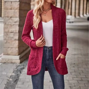 Detailed texture of rib-knit fabric on deep red open front cardigan with large pockets