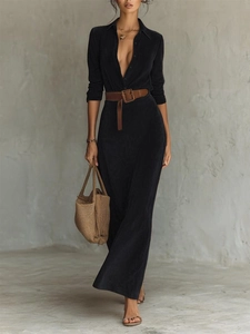 Detail of black long-sleeve suede dress with brown leather belt and shirt collar design
