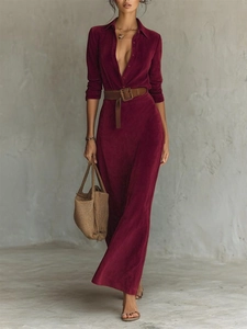 Close-up of suede texture on a deep red maxi dress featuring a dark brown leather belt