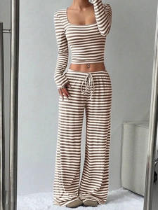 Detailed texture of brown striped rib-knit long sleeve crop top and wide-leg pants set