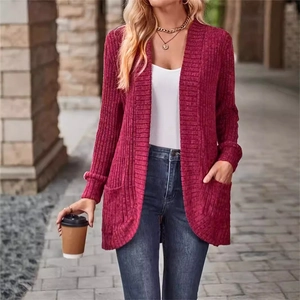 Close-up detail of wine red long cardigan with ribbed texture and side pockets