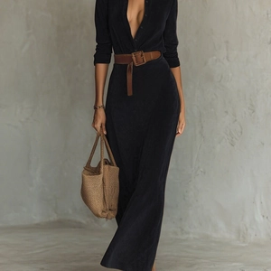 Elegant long black suede button-down dress with a wide brown belt and woven tote bag