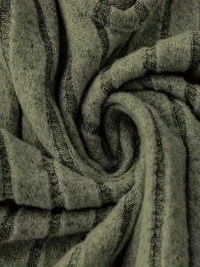 Detail of grey-green ribbed knit fabric showing soft texture and vertical stripe pattern