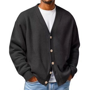 Men's V-neck waffle knit cardigan sweater in black with brown buttons and a relaxed fit