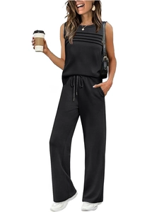 Detail of black pleated sleeveless top and drawstring wide-leg pants summer set