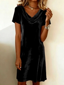 Detail of elegant cowl neck and smooth velvet fabric texture on this black slim dress