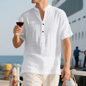 Close-up of white linen shirt featuring a grandad collar and detailed fabric texture