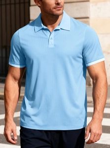 Detail of light blue waffle knit polo shirt showing textured fabric and button collar