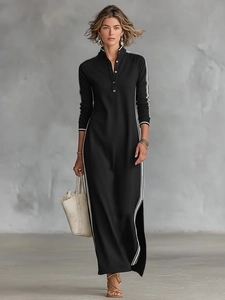 Détail d'une robe maxi noire à manches longues avec rayures blanches et col polo sport