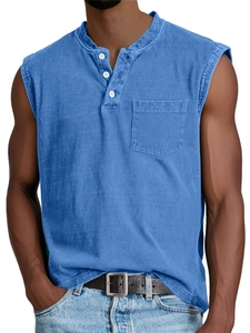 Close-up of vintage washed blue Henley vest featuring white buttons and a chest pocket