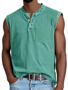 Detail of men's washed green cotton Henley tank top with three buttons and chest pocket