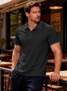 Detail of waffle-textured black polo shirt with contrasting grey collar and sleeve trim