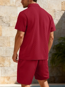 Macro shot of men's burgundy polo set featuring premium textured geometric jacquard fabric