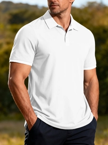 Detailed close-up of white knitted polo shirt fabric texture and ribbed cuff design