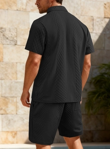 Rear view of men's black polo and shorts set featuring a diamond texture knit fabric
