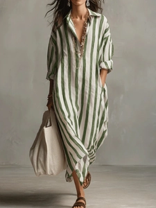 Detail of green and white striped cotton maxi dress with lapel collar and V-neckline