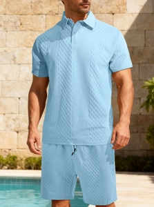 Detailed view of the light blue textured knit fabric on the men's polo set