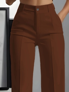 Detail of high-waist dark brown trousers featuring a button closure and sharp front pleats