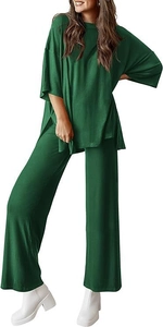 Detail of dark green two-piece lounge set showing the soft knit texture and side slit hem