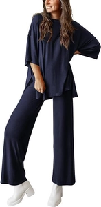 Detail view of side-slit oversized dark blue top and high-waisted wide-leg knit lounge pants