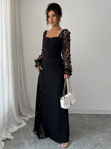 Detail of square neckline with pleated bust and sheer floral lace long sleeves on black dress
