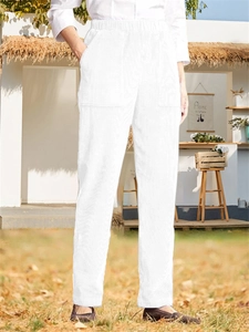 Detail of white corduroy straight pants with elastic waist and deep side pockets