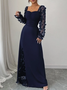 Close-up of elegant square neckline with pleated detail and 3D floral mesh sleeves