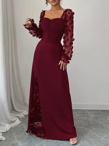 Detail of elegant wine red dress featuring sheer mesh sleeves with 3D floral lace embroidery