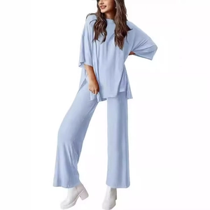 Women's casual light blue loungewear set featuring loose crew neck top and wide leg pants