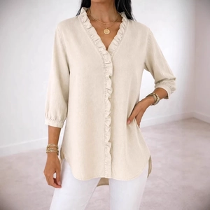 Women's ruffle V-neck shirt in light beige featuring three-quarter sleeves and curved hem