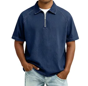 Detailed close-up of blue denim polo shirt showing metal zipper and collar texture